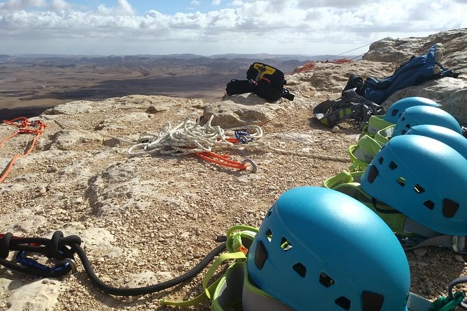 Rappelling Down the Ramon Crater Cliff - Stepping over the Ramon Crater rim