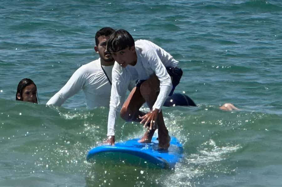 Tel Aviv: Professional Surfing Lessons at Beach Club TLV - Practicing in Tel Aviv’s Mediterranean waves